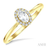 5x3 MM Oval Shape White Topaz and 1/20 Ctw Round Cut Diamond Halo Semi-Precious Ring in 10K Yellow Gold
