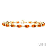 6X4 MM Oval Cut Citrine and 1/6 Ctw Round Cut Diamond Semi-Precious Tennis Bracelet in 10K Yellow Gold