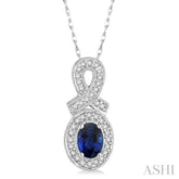 6x4 MM Oval Cut Sapphire and 1/5 Ctw Round Cut Diamond Pendant in 10K White Gold with Chain