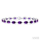 6X4 MM Oval Cut Amethyst and 1/6 Ctw Round Cut Diamond Semi-Precious Tennis Bracelet in 10K White Gold