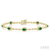 5x3 MM Oval Cut Emerald and 1/20 Ctw Round Cut Diamond Bracelet in 10K Yellow Gold