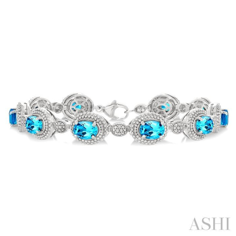7X5 MM Oval Shape Blue Topaz and 1/10 Ctw Single Cut Diamond Semi-Precious Bracelet in Sterling Silver