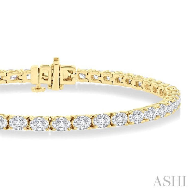 5 1/2 Ctw East West Oval Cut Diamond Fashion Tennis bracelet in 14K Yellow Gold