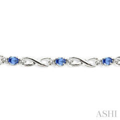 4x3mm Oval Cut Tanzanite and 1/10 Ctw Single Cut Diamond Bracelet in 10K White Gold