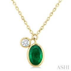 6x4 MM Oval Cut Emerald and 1/20 Ctw Bezel Set Round Cut Diamond Precious Pendant With Chain in 14K Yellow Gold