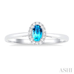 5x3 MM Oval Shape Blue Topaz and 1/20 Ctw Single Cut Diamond Halo Semi-Precious Ring in 10K White Gold