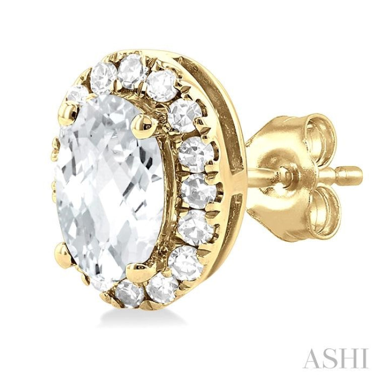 5x3 MM Oval Shape White Topaz and 1/8 Ctw Single Cut Diamond Halo Semi-Precious Stud Earrings in 14K Yellow Gold