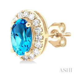 5x3 MM Oval Shape Blue Topaz and 1/8 Ctw Single Cut Diamond Halo Semi-Precious Stud Earrings in 14K Yellow Gold