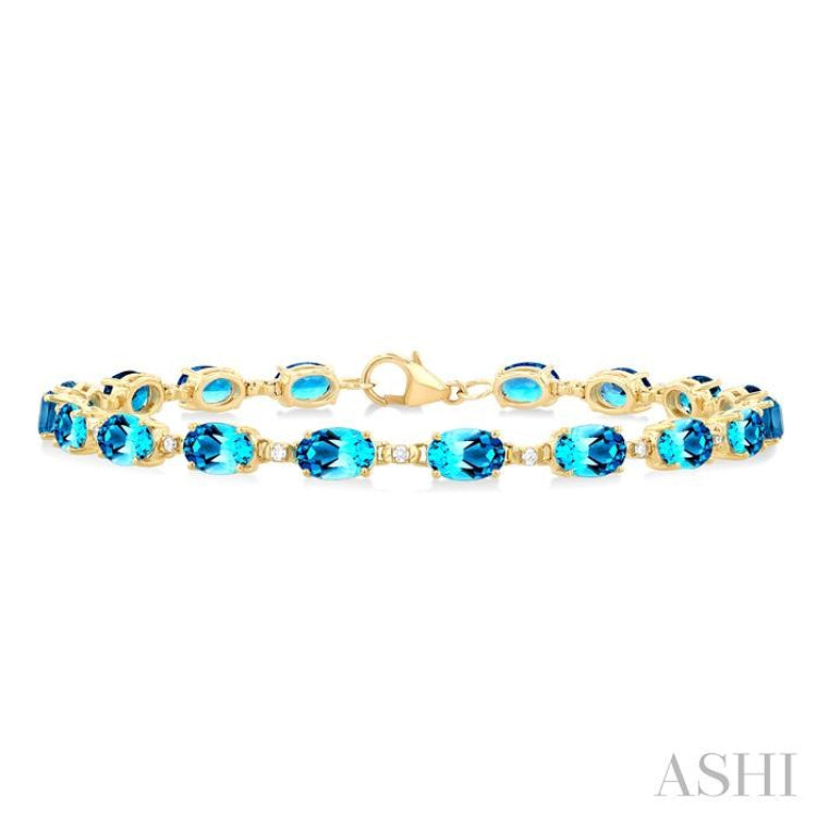 6X4 MM Oval Cut Blue Topaz and 1/6 Ctw Round Cut Diamond Semi-Precious Tennis Bracelet in 10K Yellow Gold