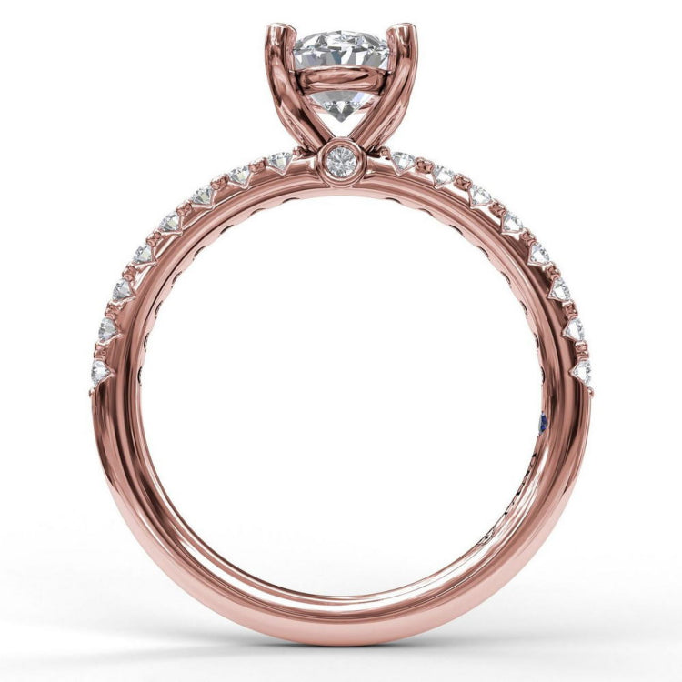 Classic Single Row Engagement ring with an Oval Center Diamond.