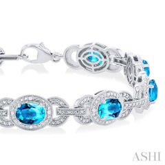 7x5 MM Oval Shape Blue Topaz and 1/10 Ctw Round Cut Diamond Semi-Precious Bracelet in Sterling Silver