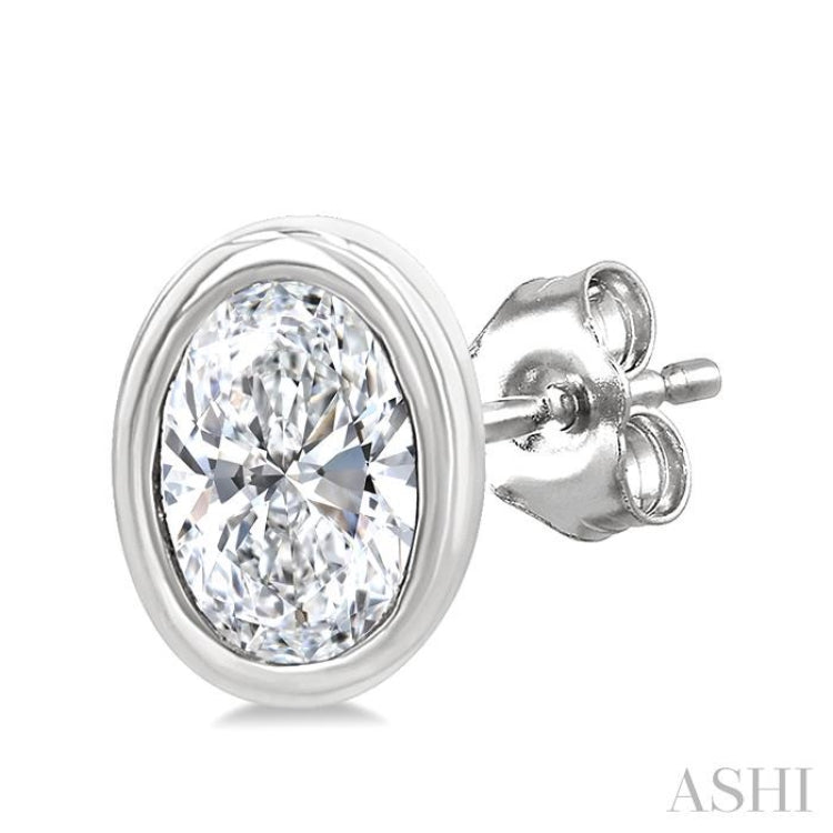 1/5 Ctw Petite Bezel Set Oval Cut Diamond Fashion Stud Earring in 10K White Gold